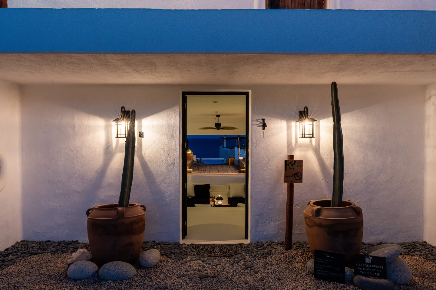 Lobby entrance lit at dusk — NEST Baja