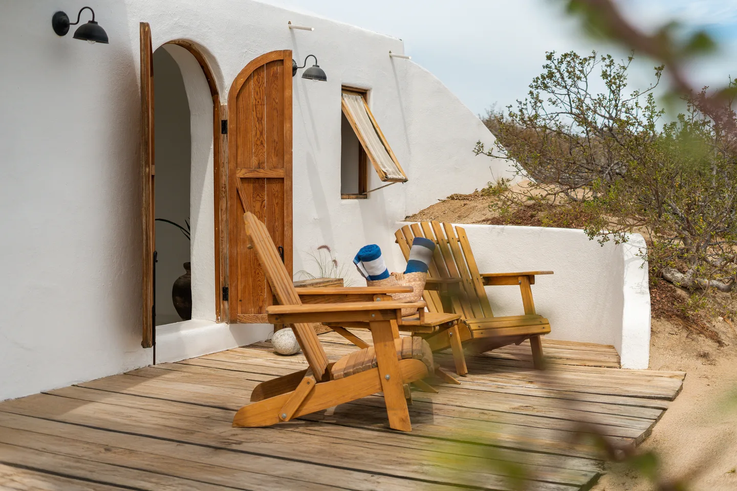 Adirondack chairs on the private patio — NEST Baja