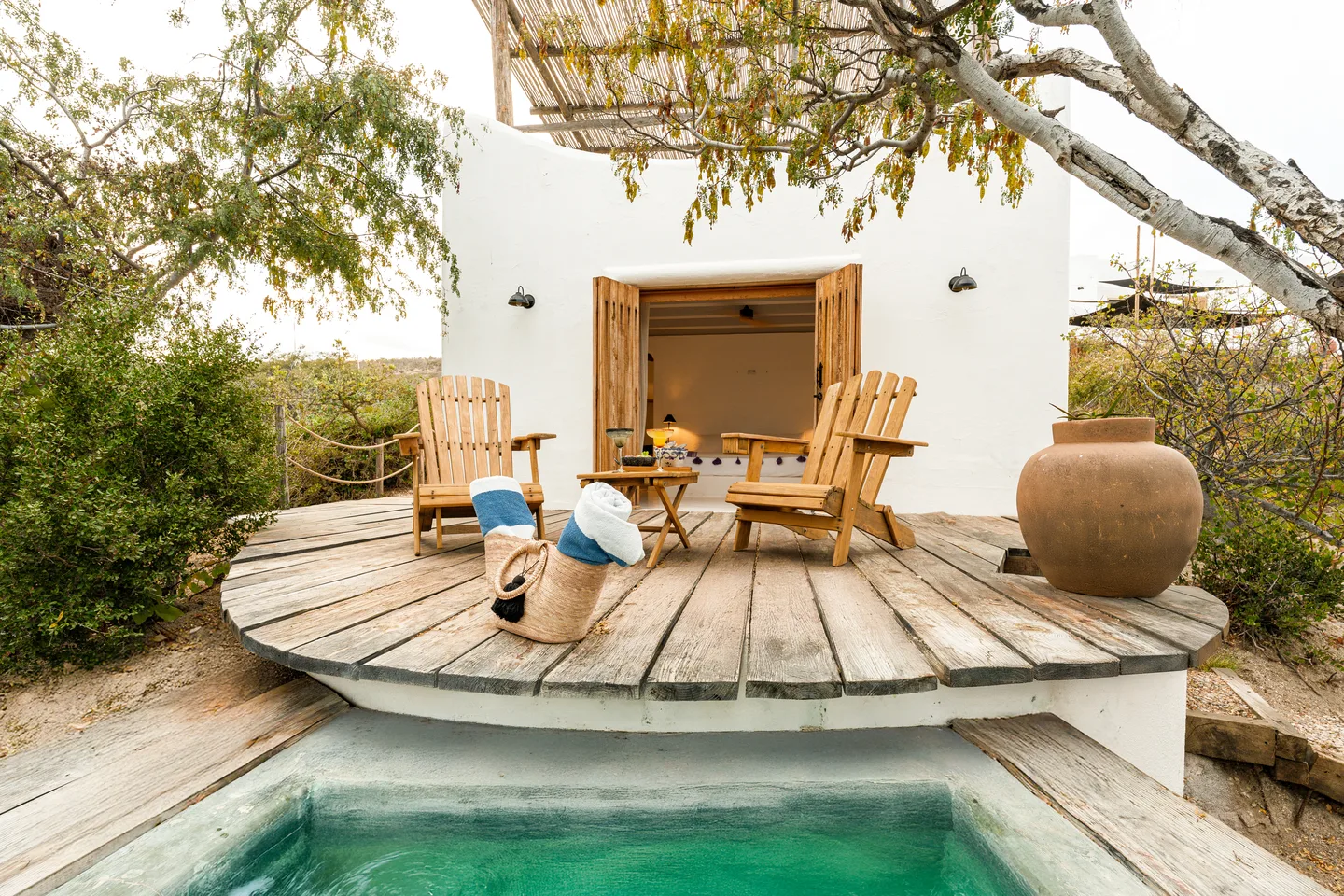 Whitewashed cottage with round wooden deck and private plunge pool — NEST Baja